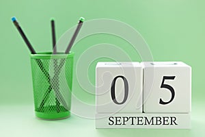 Desk calendar of two cubes for September 5