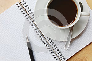 Desk with coffee and notebook