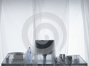 Desk And Computer Covered In Transparent Dust Sheets