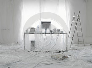 Desk And Computer Covered In Transparent Dust Sheets