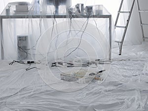 Desk And Computer Covered In Transparent Dust Sheets