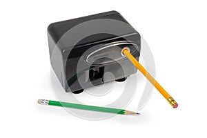 Desk electric pencil sharpener and pencils on a white background