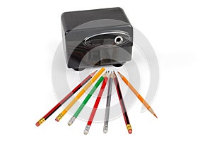 Desk electric pencil sharpener and pencils on a white background