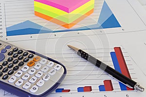 Desk with financial charts and histograms