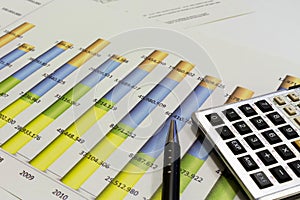 Desk with financial charts and histograms