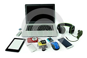Desk with gadgets or electronic equipment for daily use, laptop computer, cell phones and digital camera