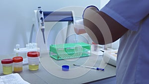 Desk in the laboratory, a laboratory technician working on tests