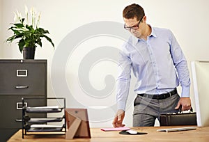 Desk, letter and confused business man with briefcase in office looking worried for employment. Anxiety, doubt or frown