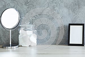 Desk with mirror, cotton pads and frame