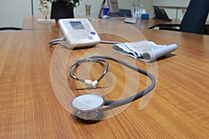 Desk of a occupational physician, with different insturments, like a stethoscope