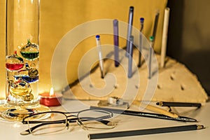 Desk with pencils and candle