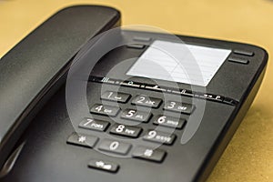 Desk phone on yellow background