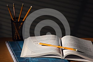 Desk with school book in night