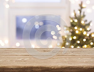 Desk space in front of defocused window with christmas tree