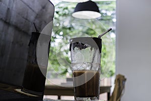 Desk of startup coworking business office with iced drink