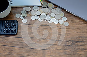 On the desk, there is a silver coin placed on it