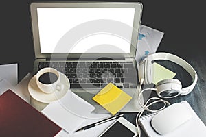 Desk with white laptop closeup