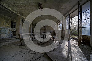 desks and chairs in abandoned school