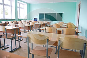 Desks with chairs in the classroom