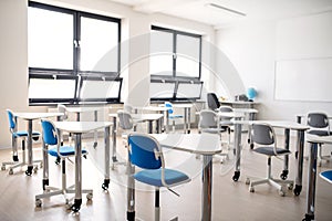 Desks in unconventional classoom in private school.