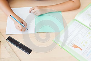 Desktop background of student sitting at desk for classwork