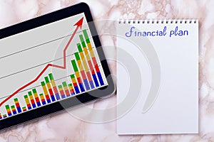 Desktop with business charts. 52-week savings plan. Financial planner