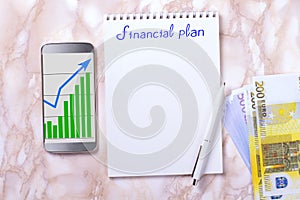 Desktop with business charts, calculator and money. 52-week savings plan. Financial planner