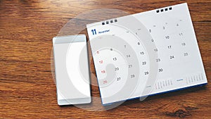 Desktop Calendar 2019 and smartphone place on wooden office desk.tment,