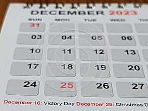 Desktop calendar december close up on a white background, 2023 concept photo