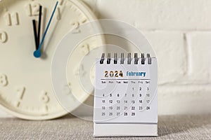 Desktop calendar for February 2024 on the table