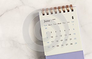 Desktop calendar for June 2024 on a light background