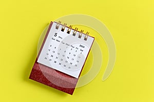 Desktop calendar for May 2024 on a yellow background