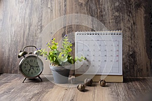 Desktop Calendar 2019 and vintage clock place on wooden office desk.Calender for Planner timetable,agenda appointment,organization photo