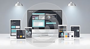 Desktop computer with website interfaces on multiple devices mock up display