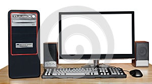 Desktop computer with widescreen display on table