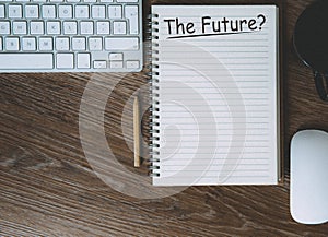 A desktop flat lay of a vintage and futuristic desk with the future heading being questioned