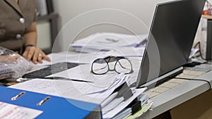 Desktop Laptop and annual report placed on office desk photo