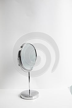 Desktop round make-up mirror on white background
