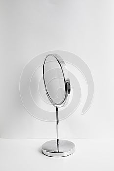 Desktop round make-up mirror on white background