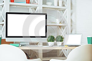 Desktop with white computer screen