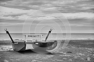 Desolate beach with lifeguard boat by the sea