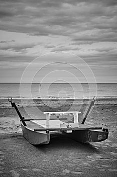 Desolate beach with rescue boat by the sea in Rimini