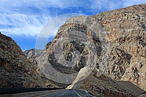 Desolate road through desert mountains