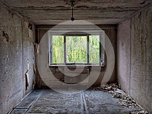 Desolate room with debris and broken radiator