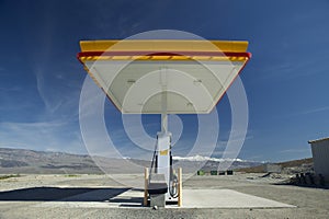 A desolate Shell Gas Station with a sign reading Self on it is located in Death Valley National Park near entrance, CA