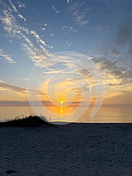 Desolate Turtle Beach on Florida\'s Gulf coast right before a beautiful blue and orange sunset sunset