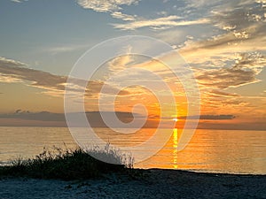 Desolate Turtle Beach on Florida\'s Gulf coast right before a beautiful blue and orange sunset sunset