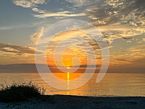 Desolate Turtle Beach on Florida\'s Gulf coast right before a beautiful blue and orange sunset sunset