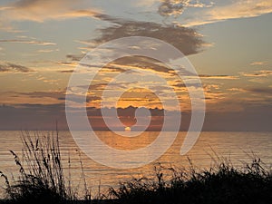 Desolate Turtle Beach on Florida\'s Gulf coast right before a beautiful blue and orange sunset sunset