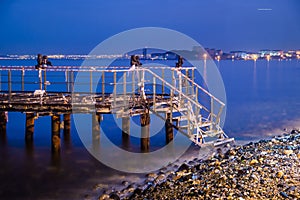 Desolated Dock Blue Night With Calm Sea photo